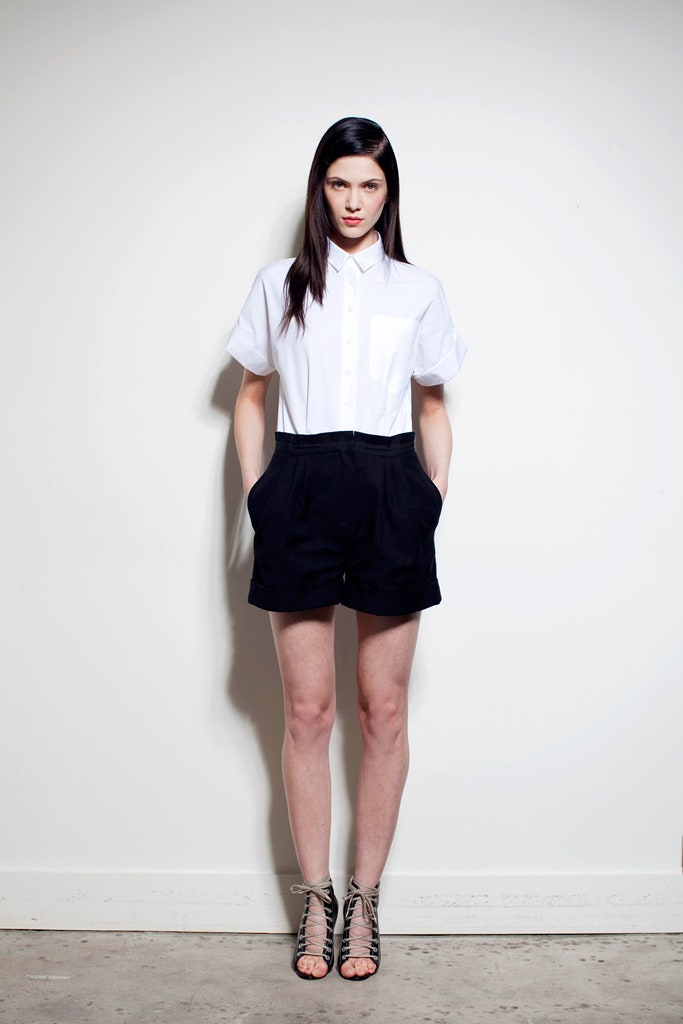 white relaxed shirt black shorts