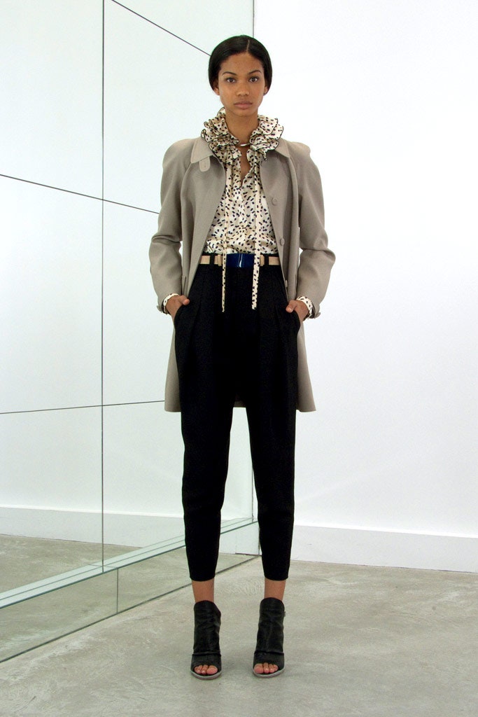 beige coat with ruffled blouse