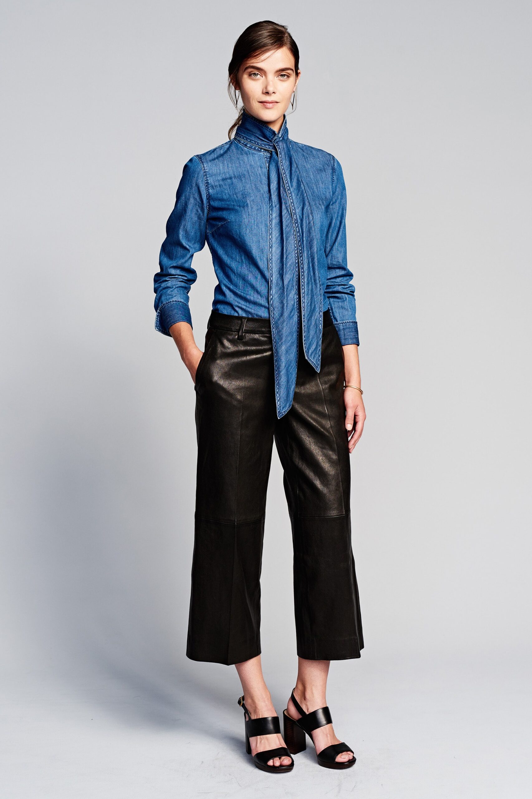 blue denim shirt with black leather pants