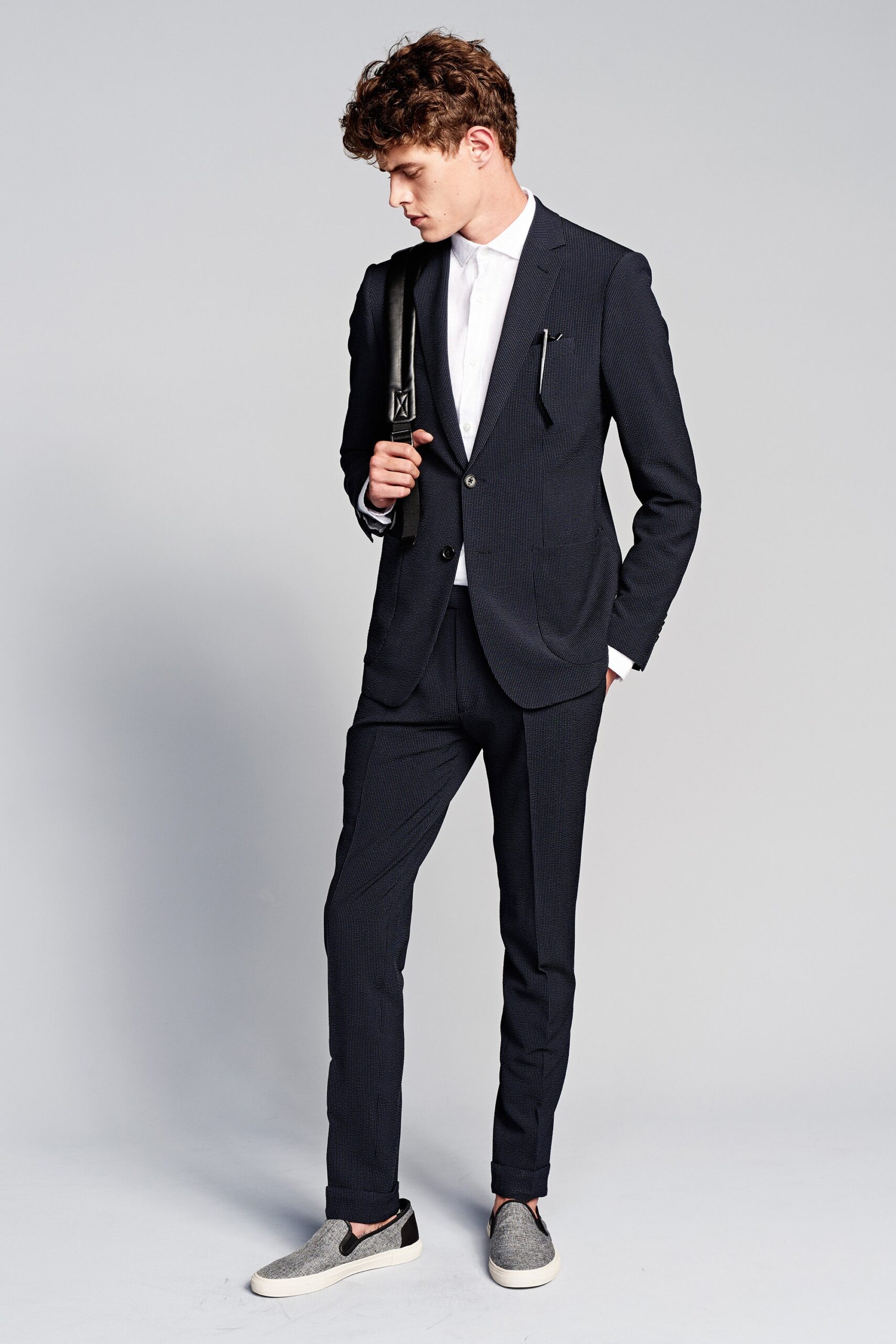 tailored black suit with white shirt