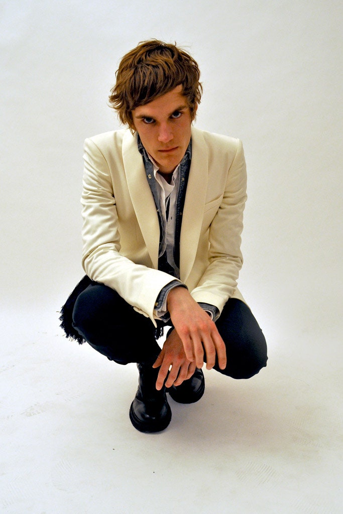 white tailored blazer with black pants