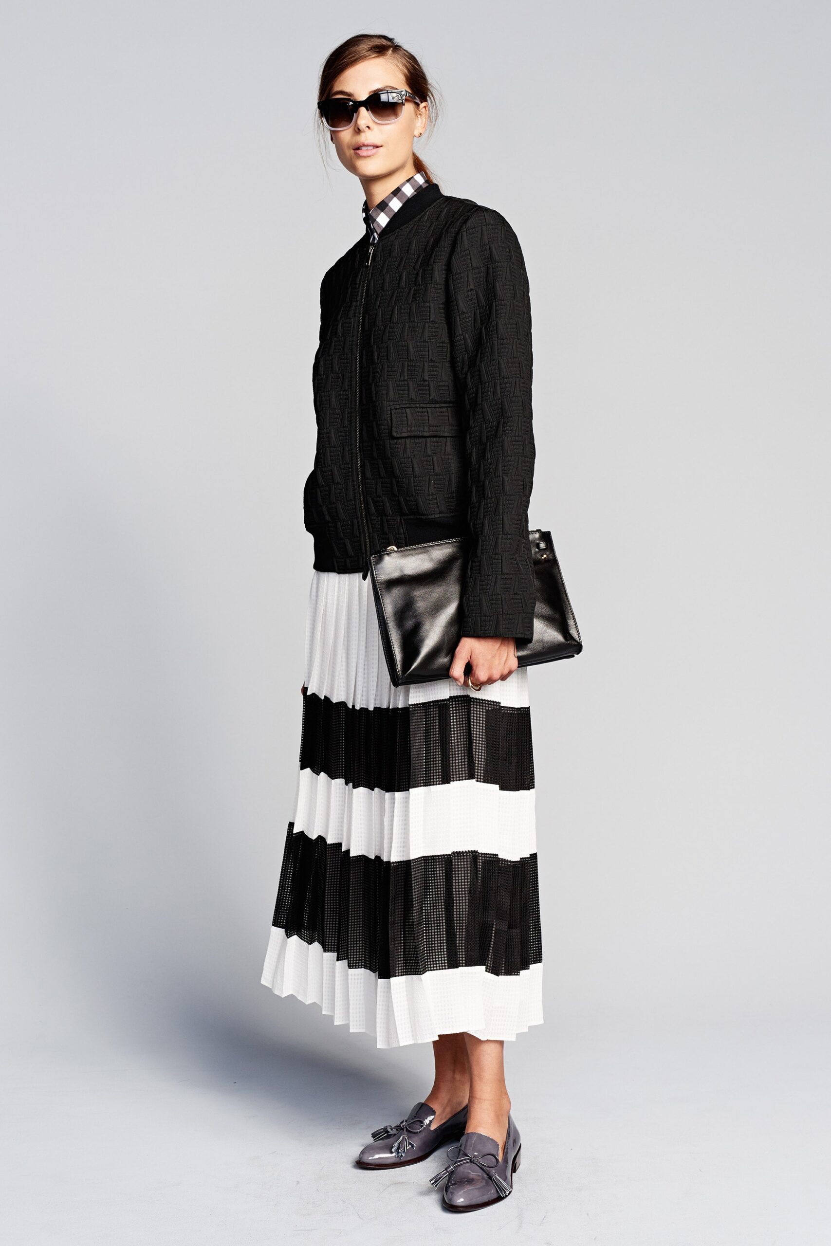 black fitted jacket with pleated skirt