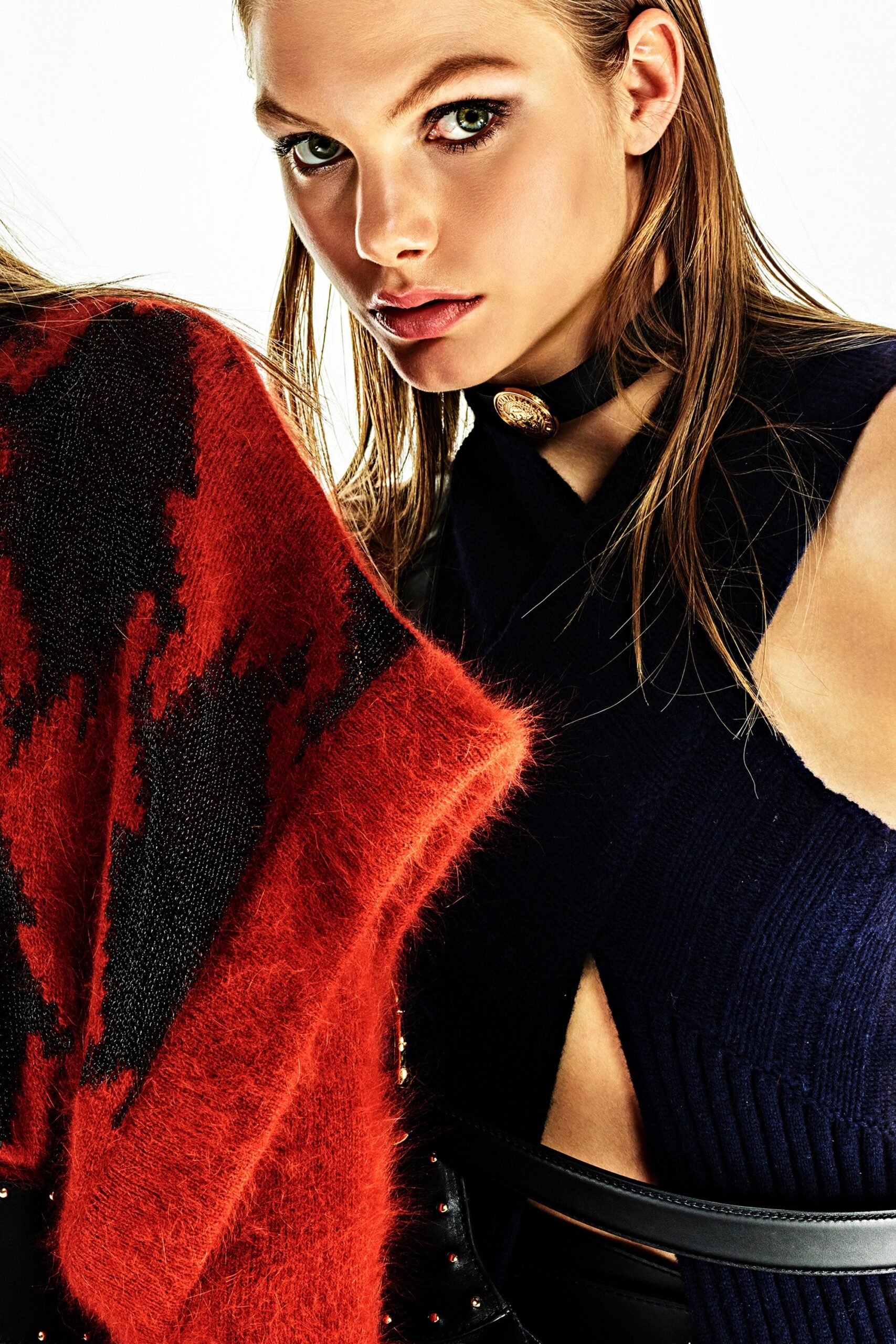 black fitted top with red poncho