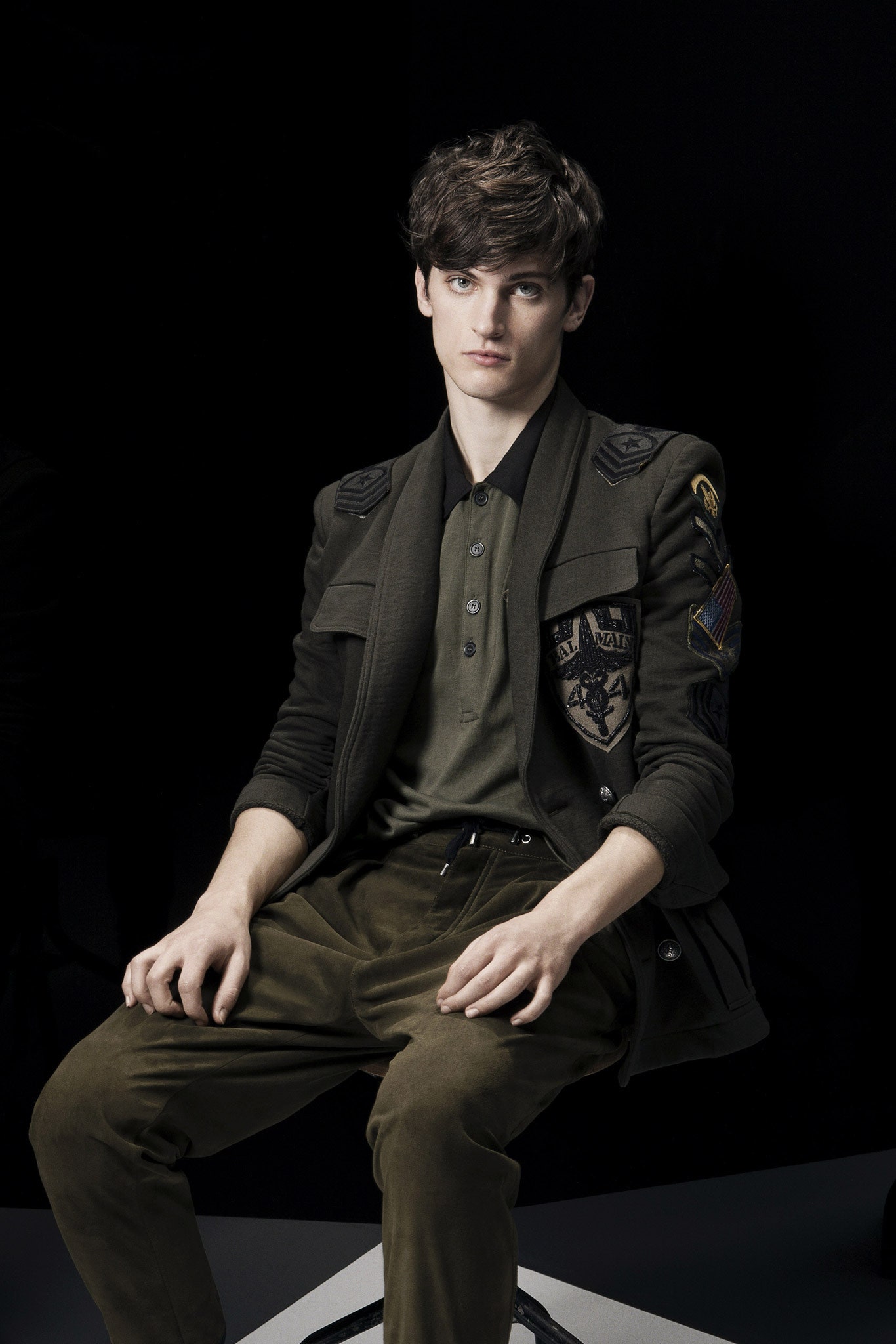 fitted green jacket with black shirt