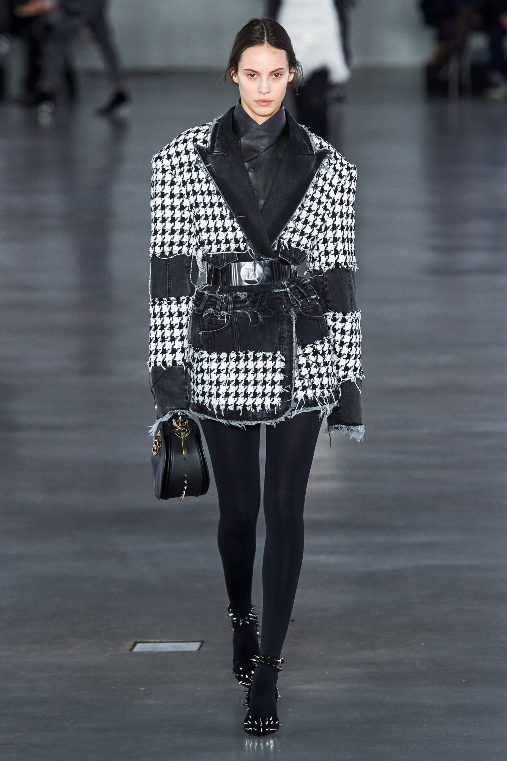 fitted black and white blazer with distressed pants