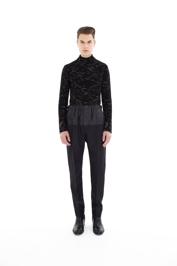 black fitted mesh top and tailored pants