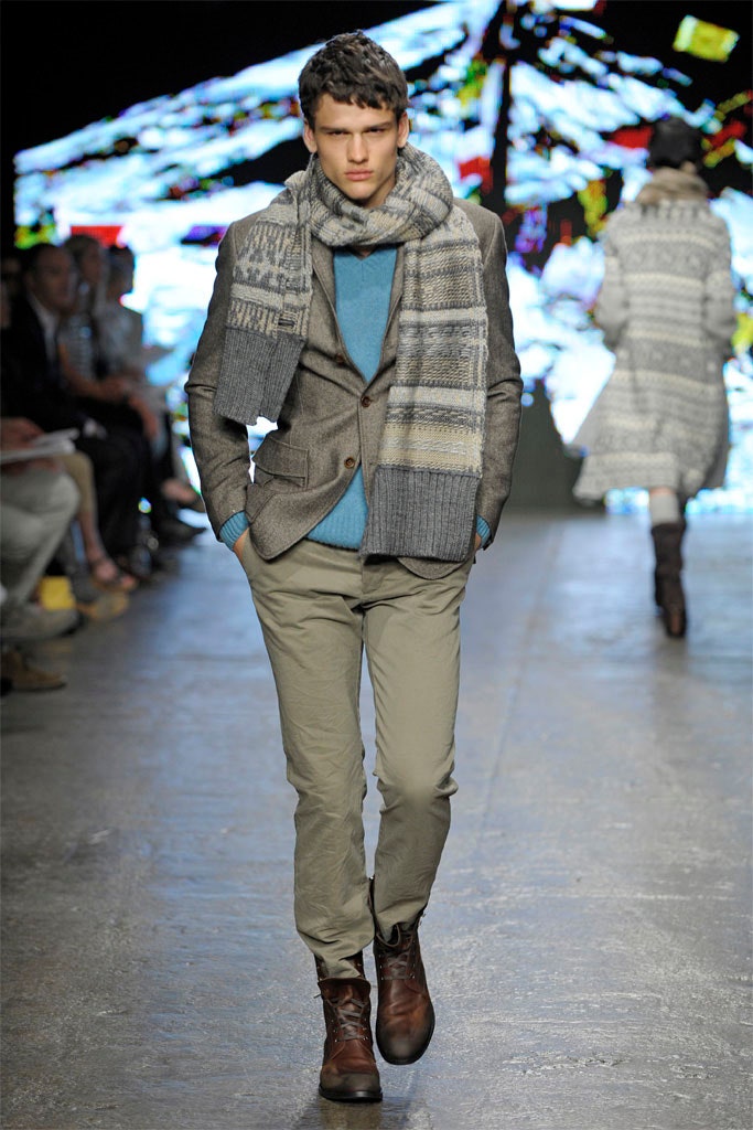 gray tailored blazer with blue sweater