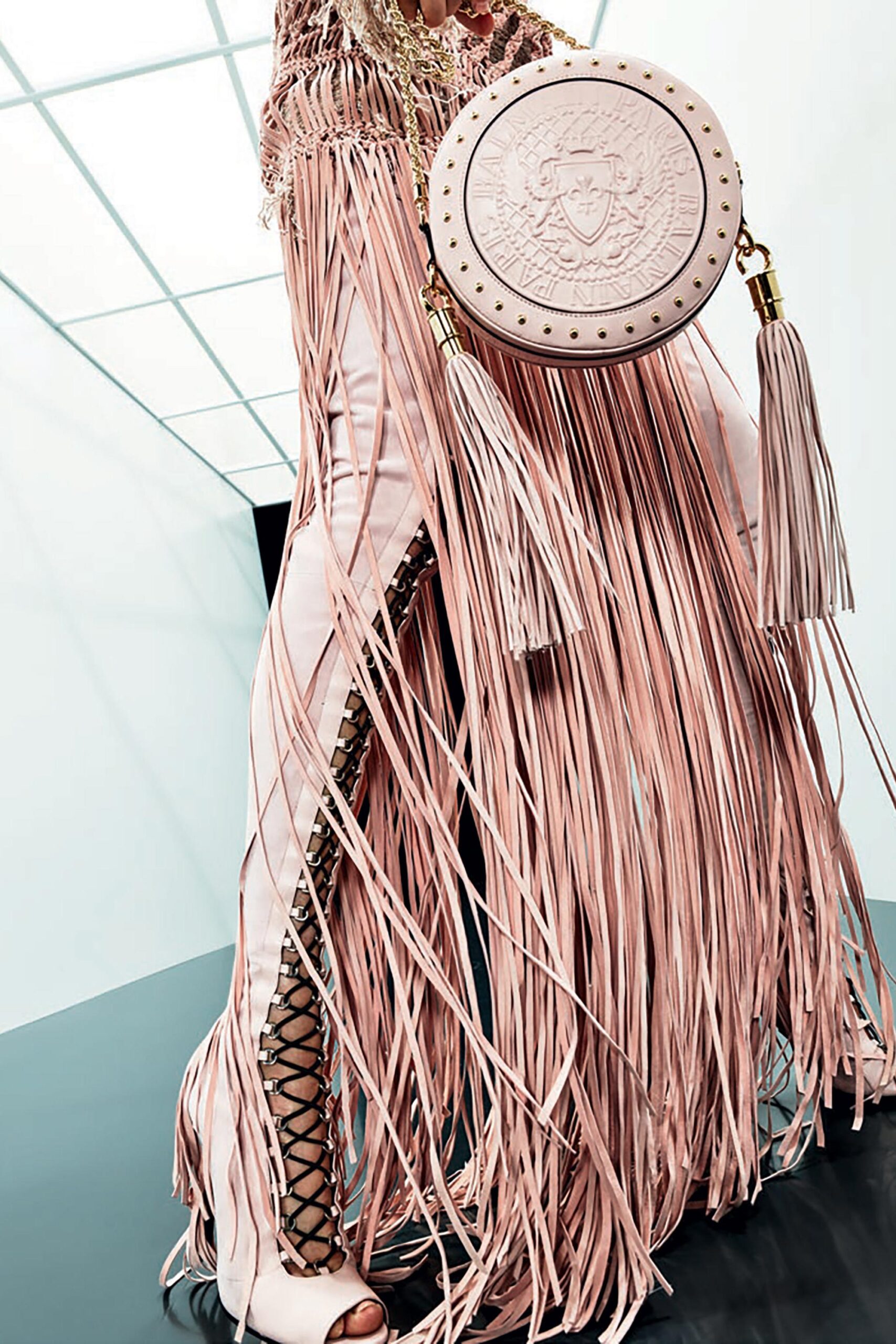 pink leather fringed pants and bag