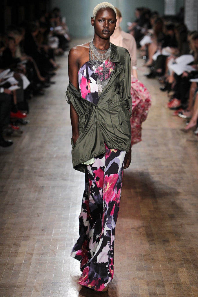 green jacket and multi-colored dress