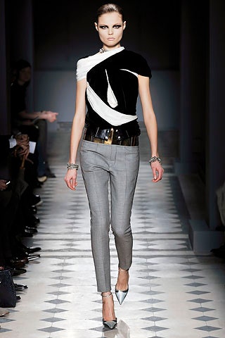 fitted black and white top with tailored gray pants