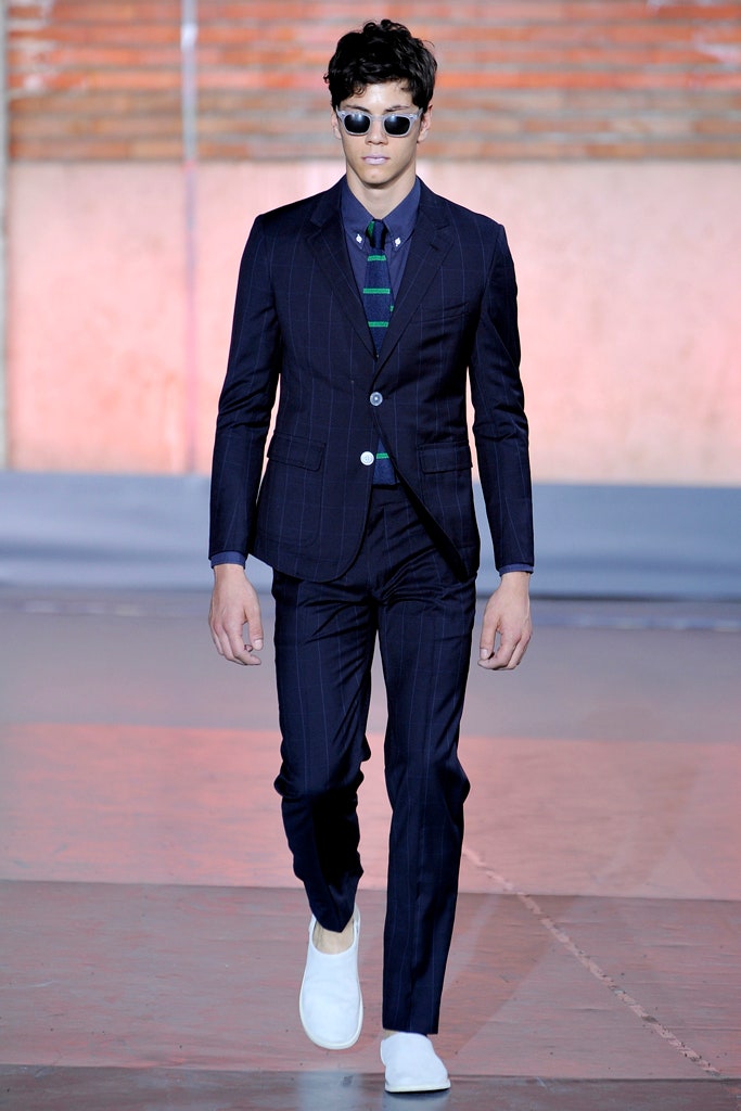 navy tailored suit with white shoes
