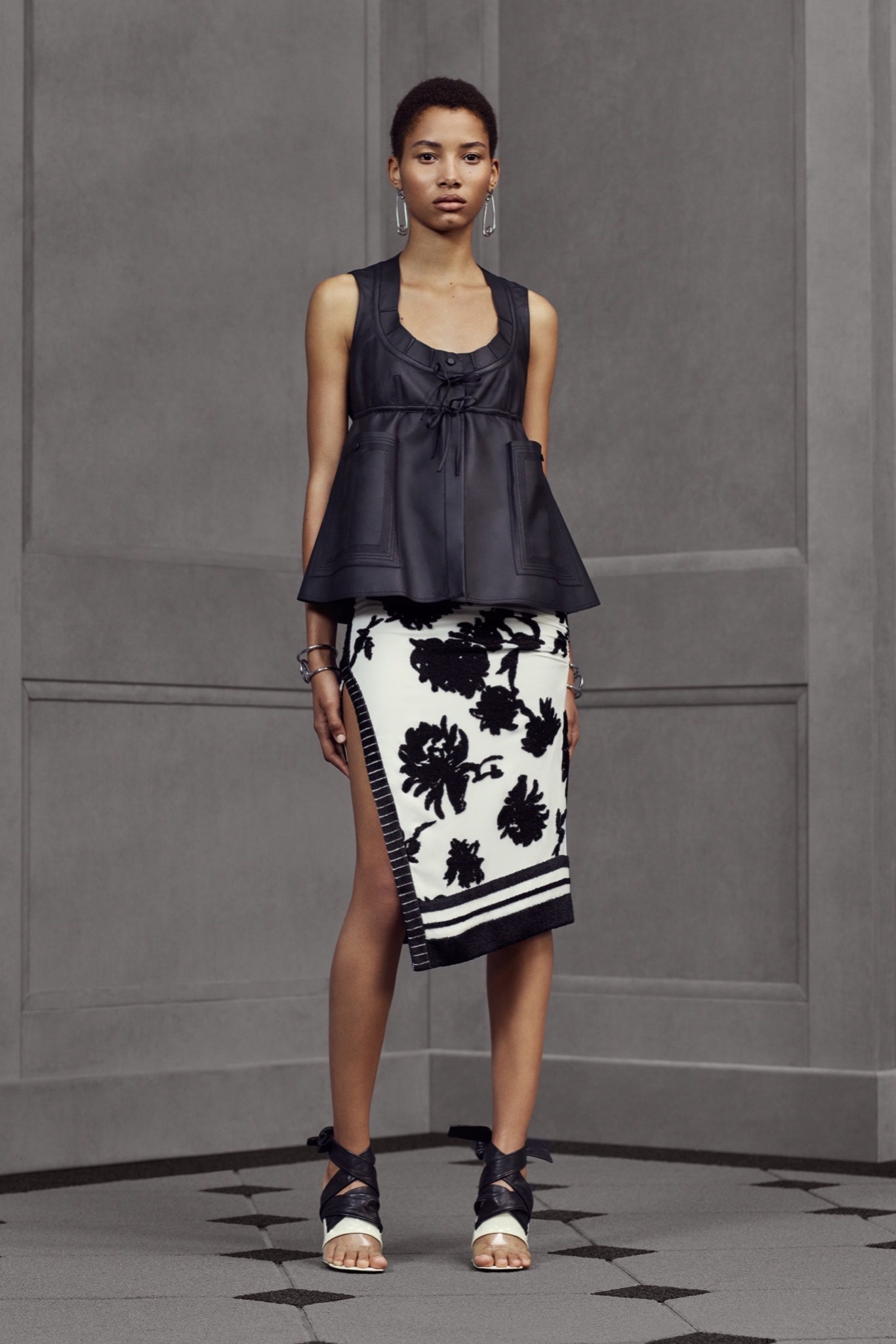 black silk sleeveless top and asymmetric skirt