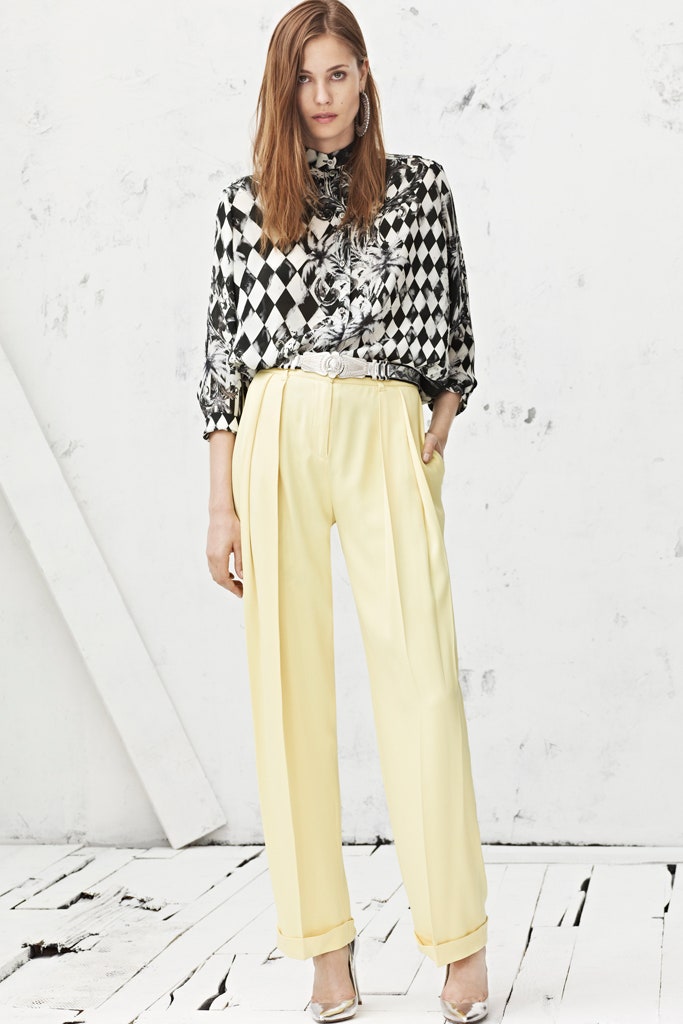 black and white printed blouse with yellow pants