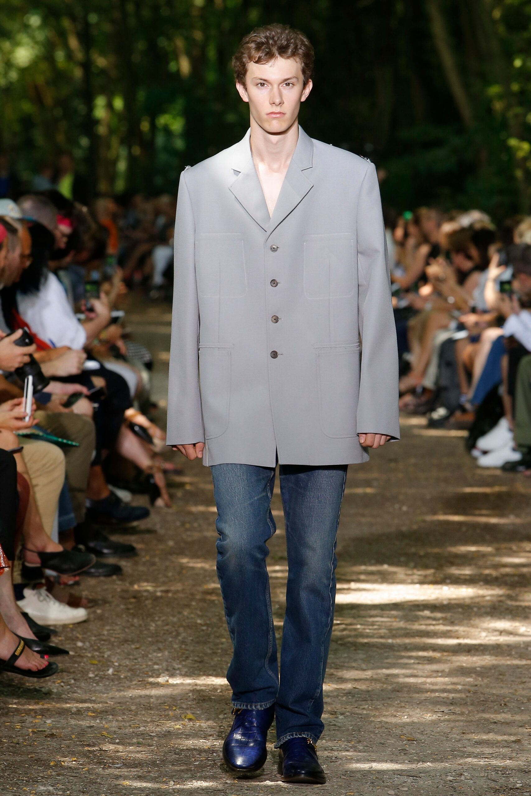 gray relaxed blazer with blue jeans
