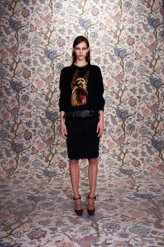 black sweater and textured skirt