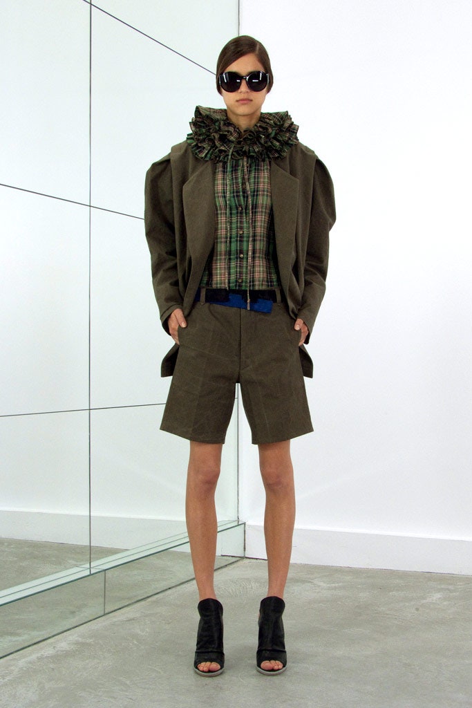 structured brown jacket with checked shirt