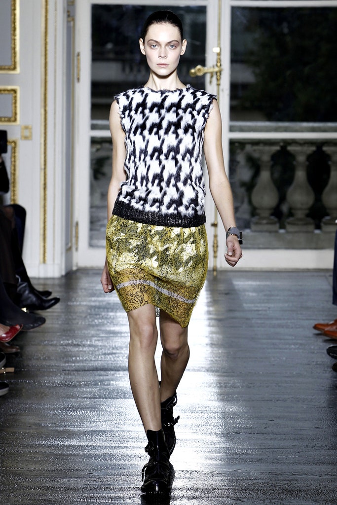 black and white printed top with gold skirt