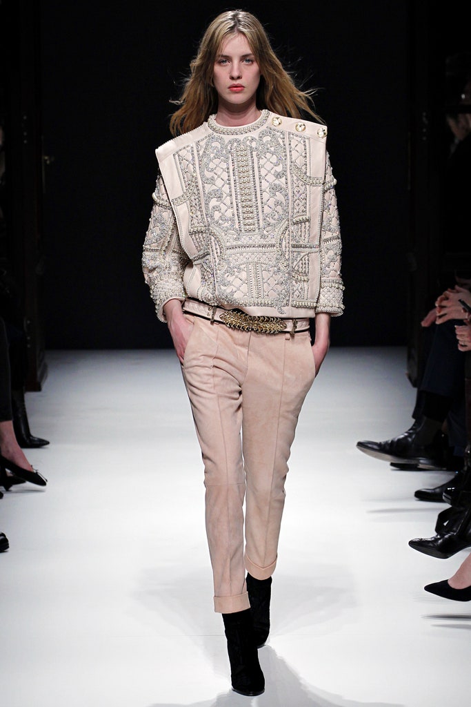 beige embroidered sweater with pink pants