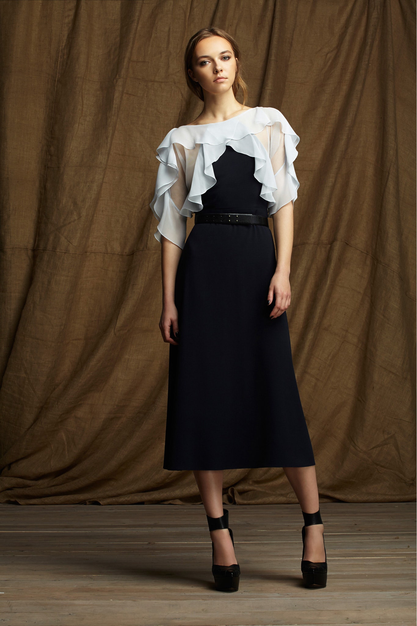 black fitted midi dress with white cape