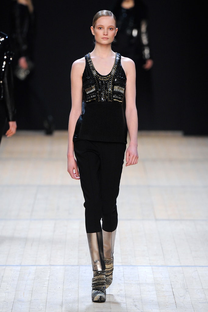 black sequined sleeveless top with fitted pants