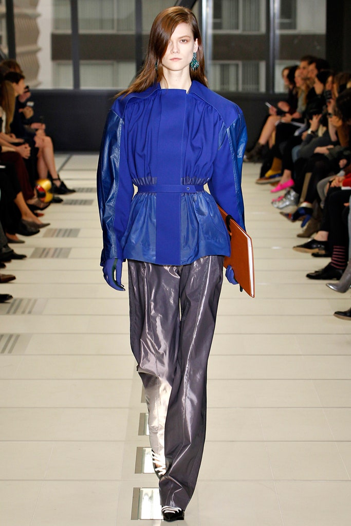 blue silk fitted top and gray pants