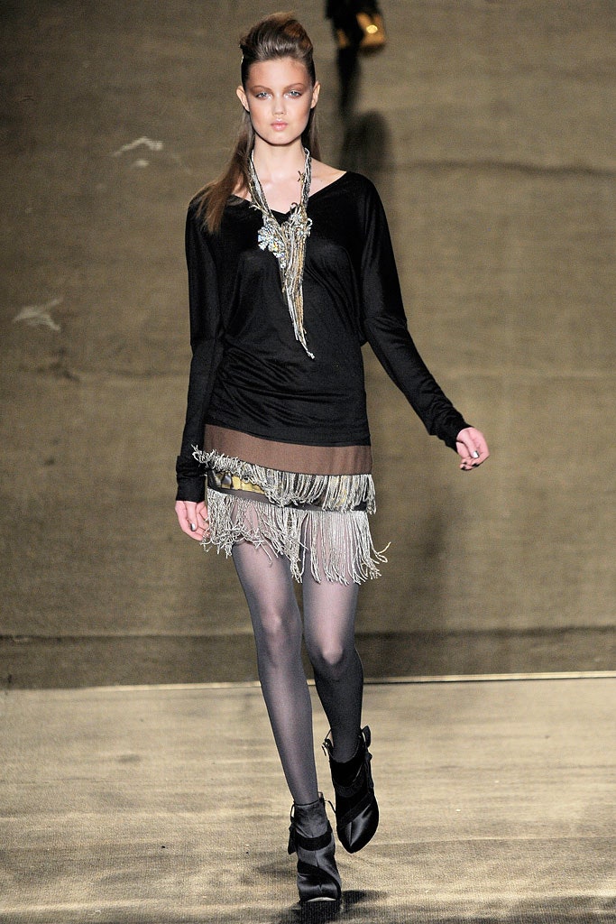 black fitted top with fringed gray mini skirt
