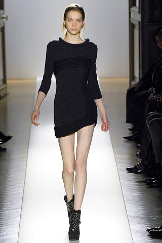 black fitted mini dress with long sleeves