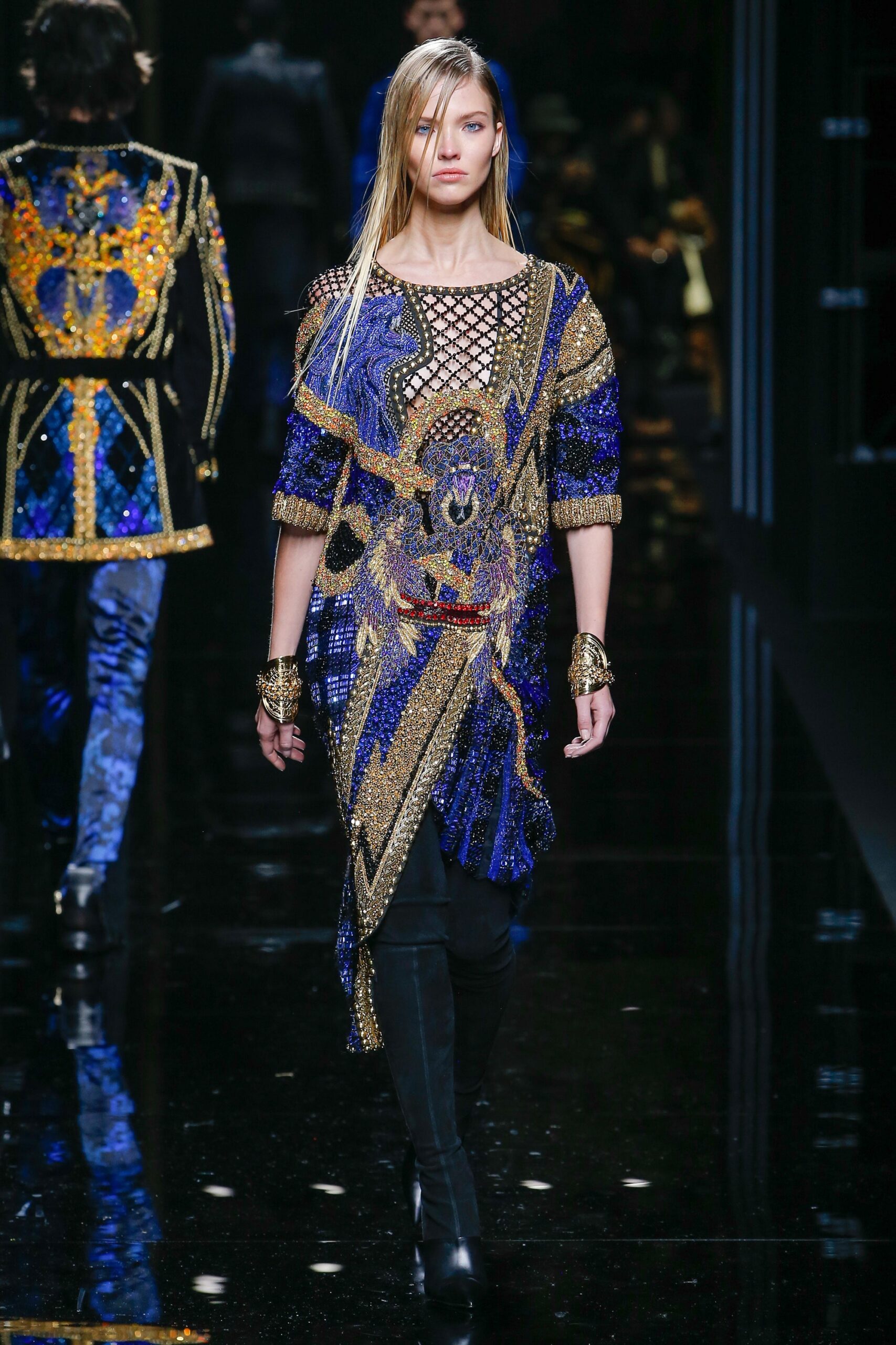 blue gold embroidered top with black pants