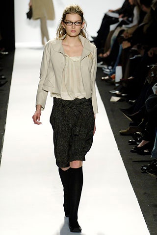 beige fitted jacket with white blouse