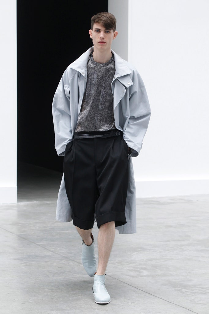 gray coat black top black shorts