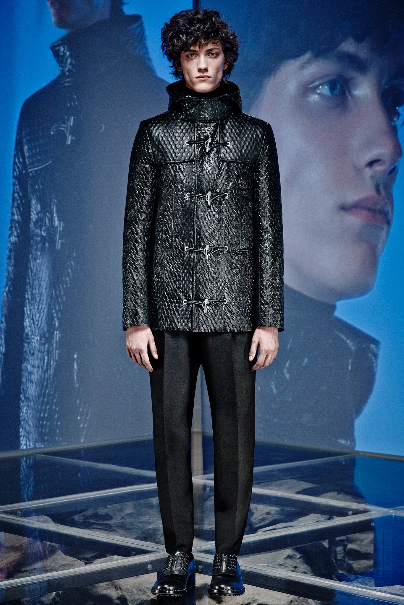 black leather long-sleeve collared fitted zippered textured jacket