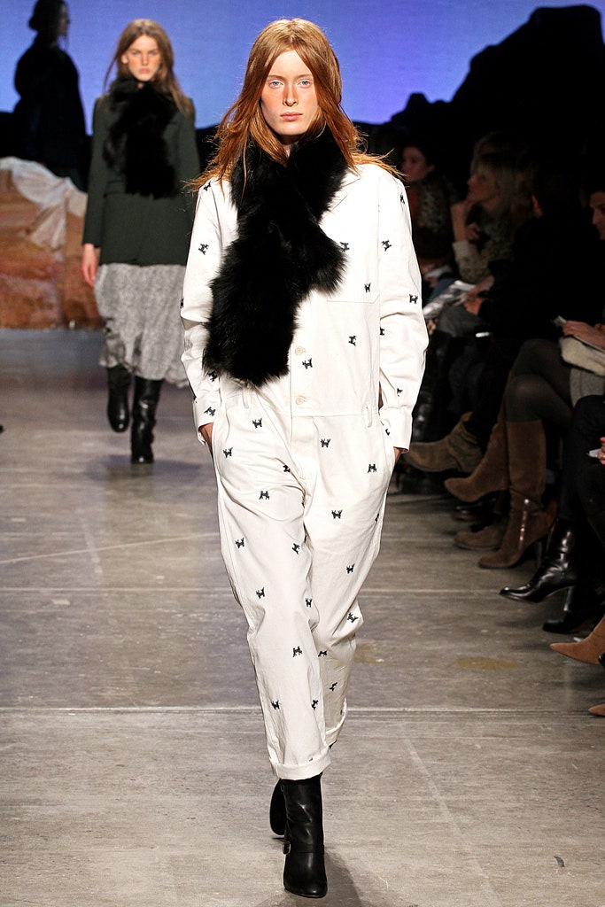 white fitted jumpsuit with black scarf