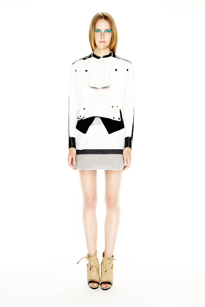 fitted white jacket with gray skirt