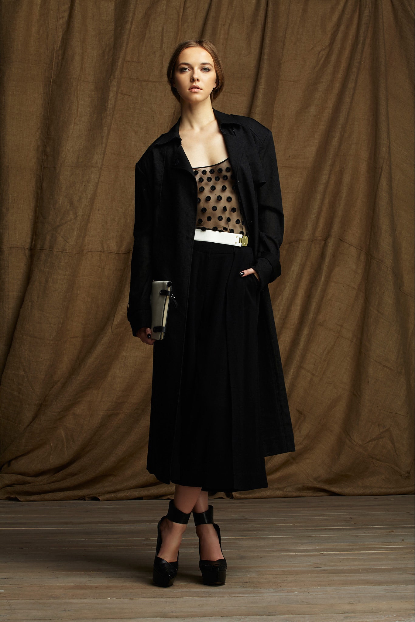 black coat beige polka-dot top