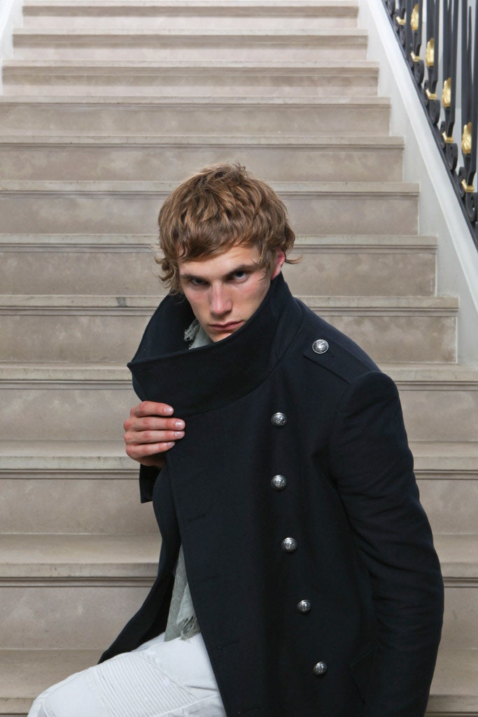 black fitted coat and white pants