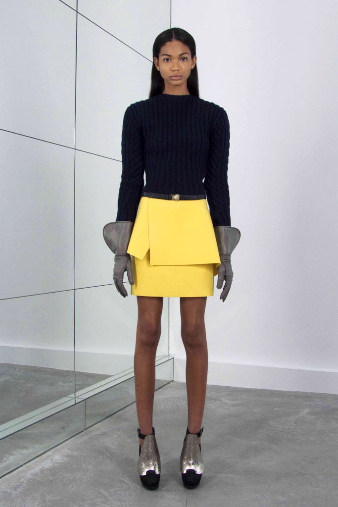 black knit top yellow asymmetric skirt