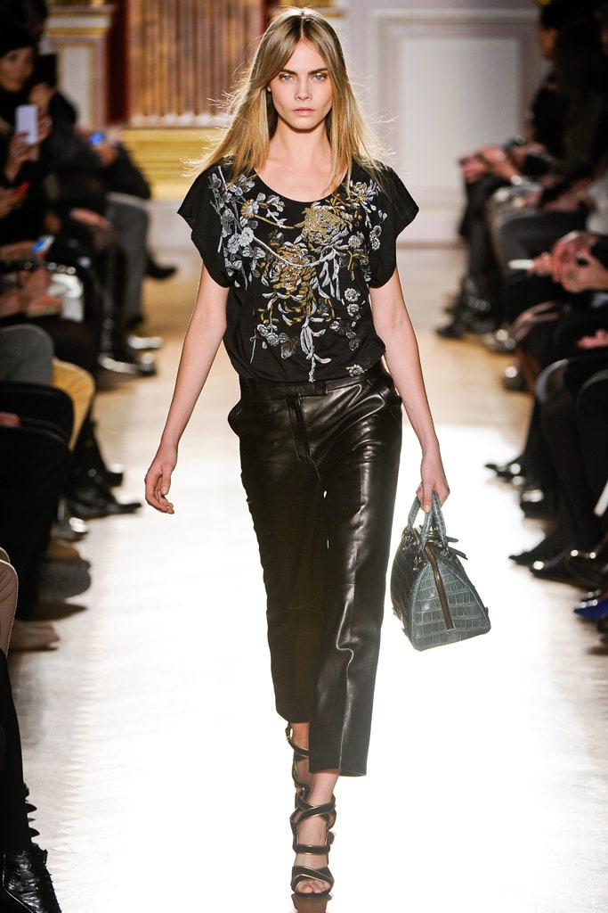 black embroidered top and leather pants