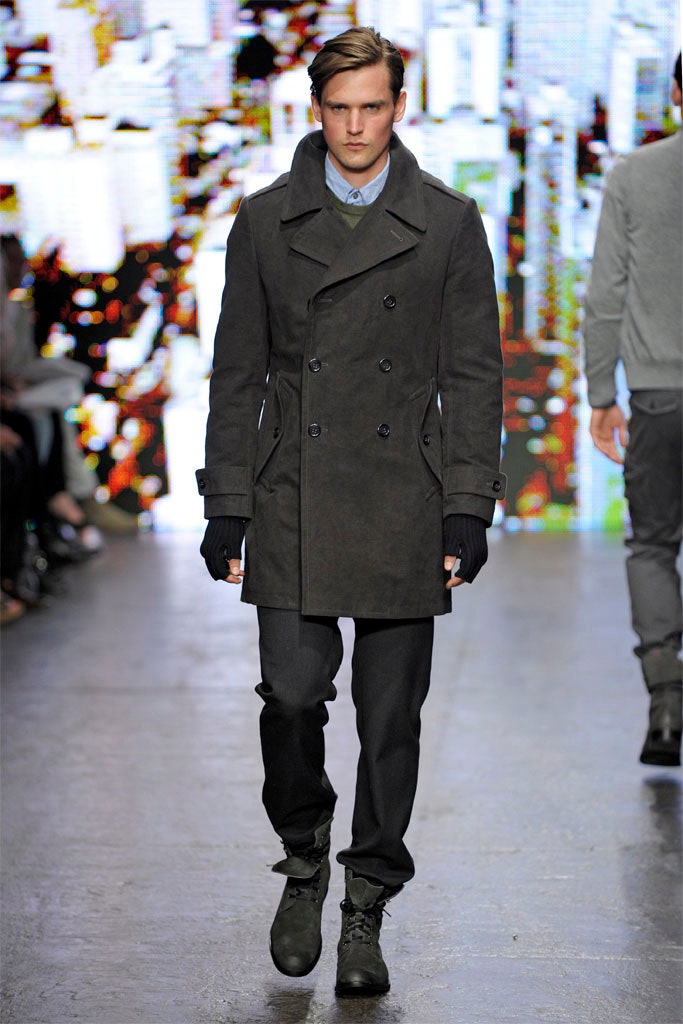 black wool long-sleeve double-breasted fitted zippered pockets coat