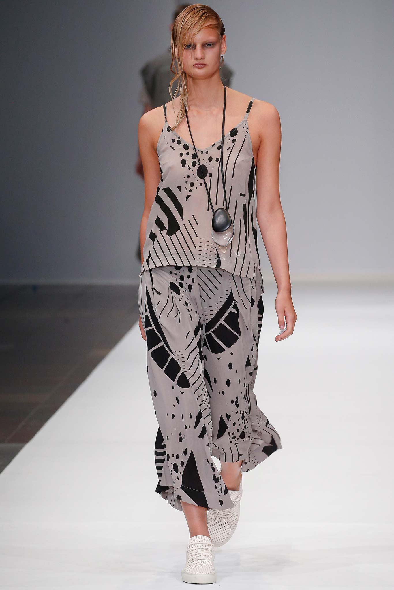 beige and black printed top and pants
