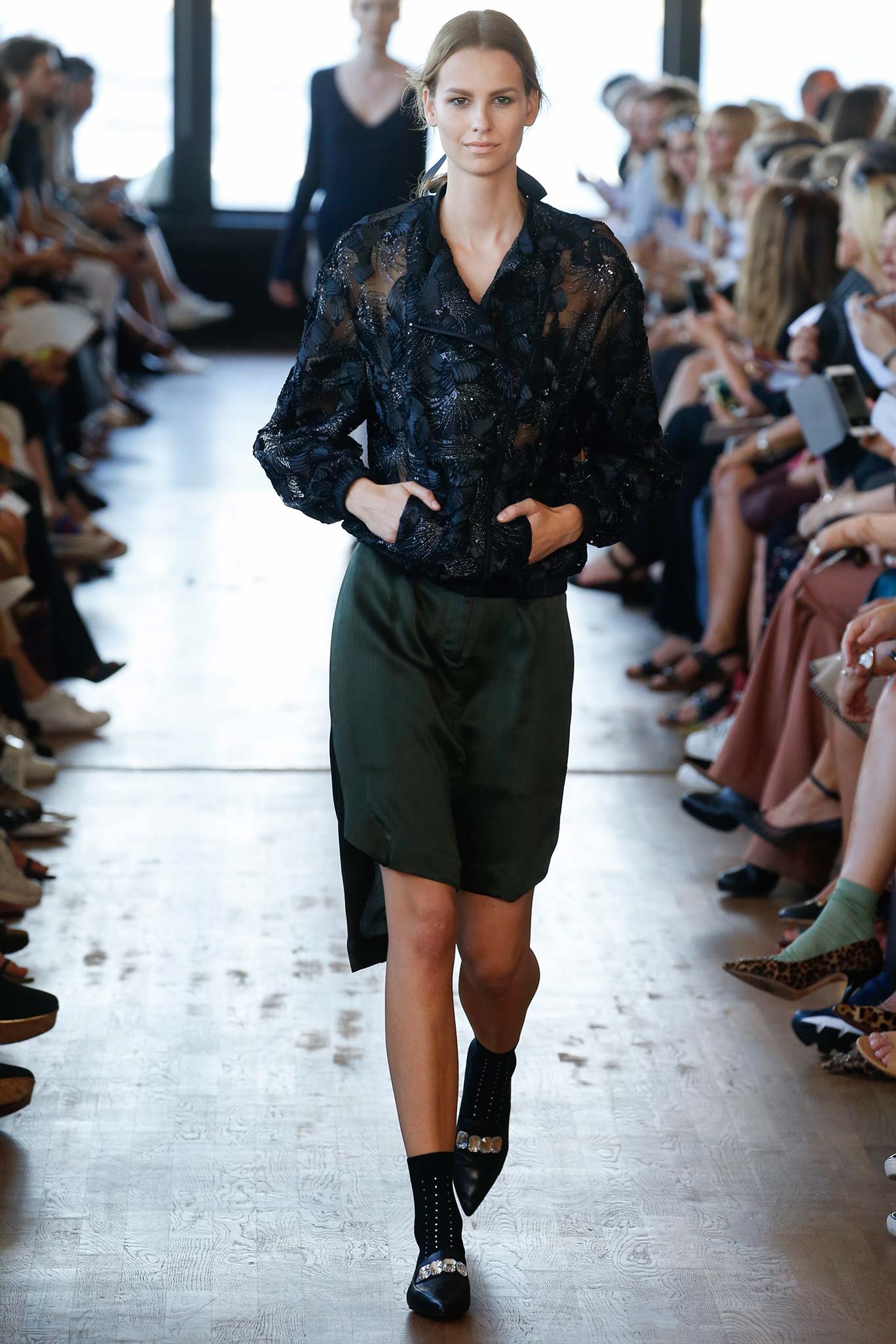 black embroidered blouse with green skirt