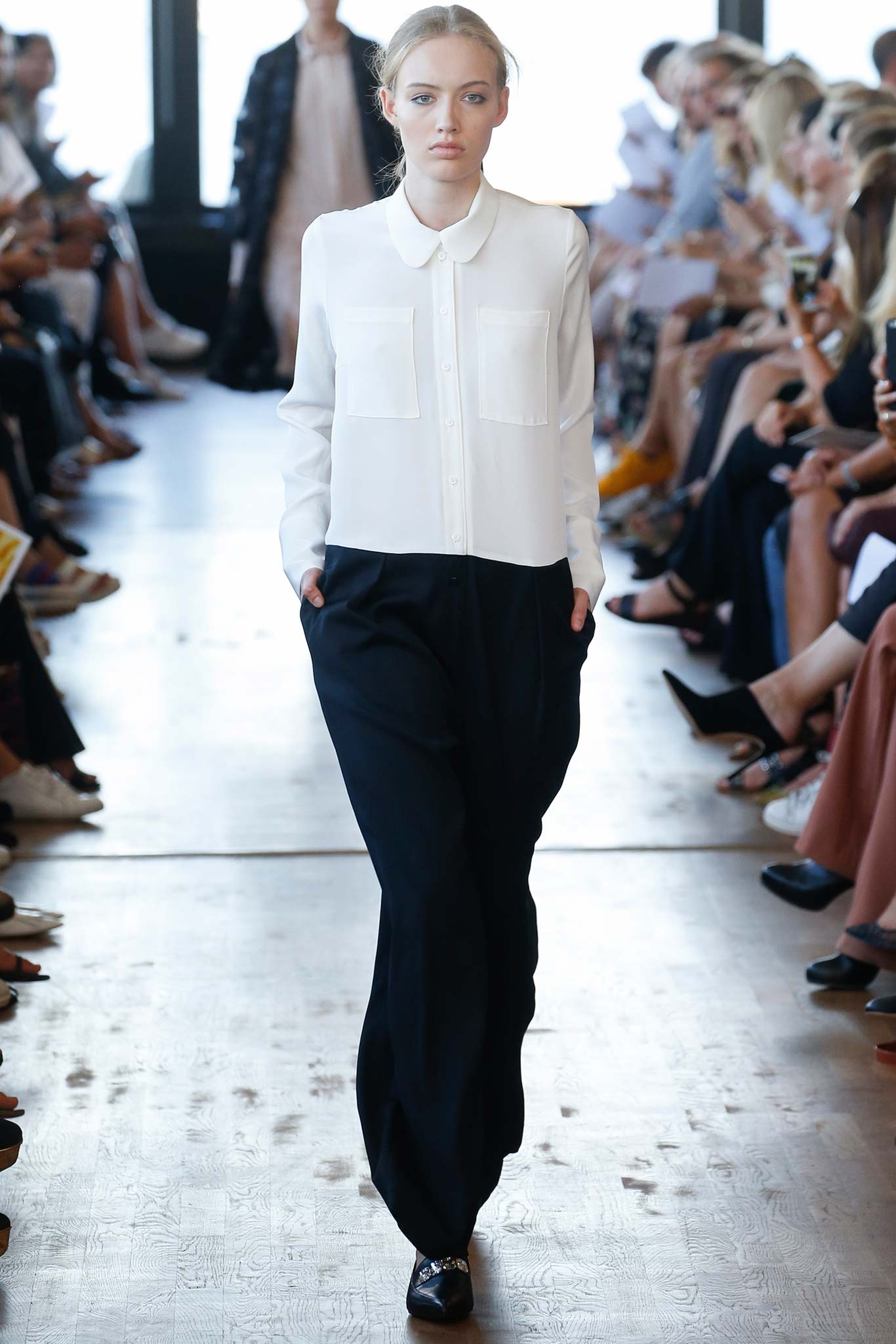 white relaxed shirt and black pants