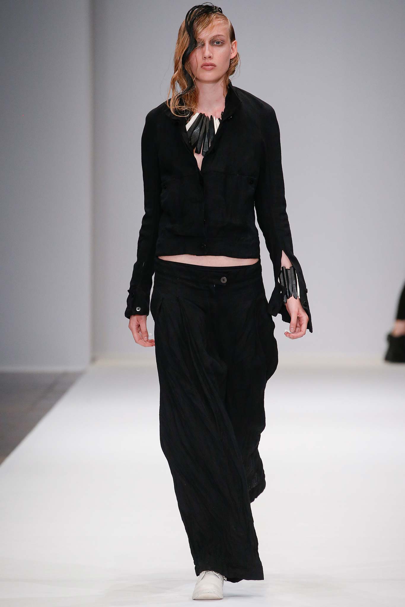 black fitted jacket and relaxed pants