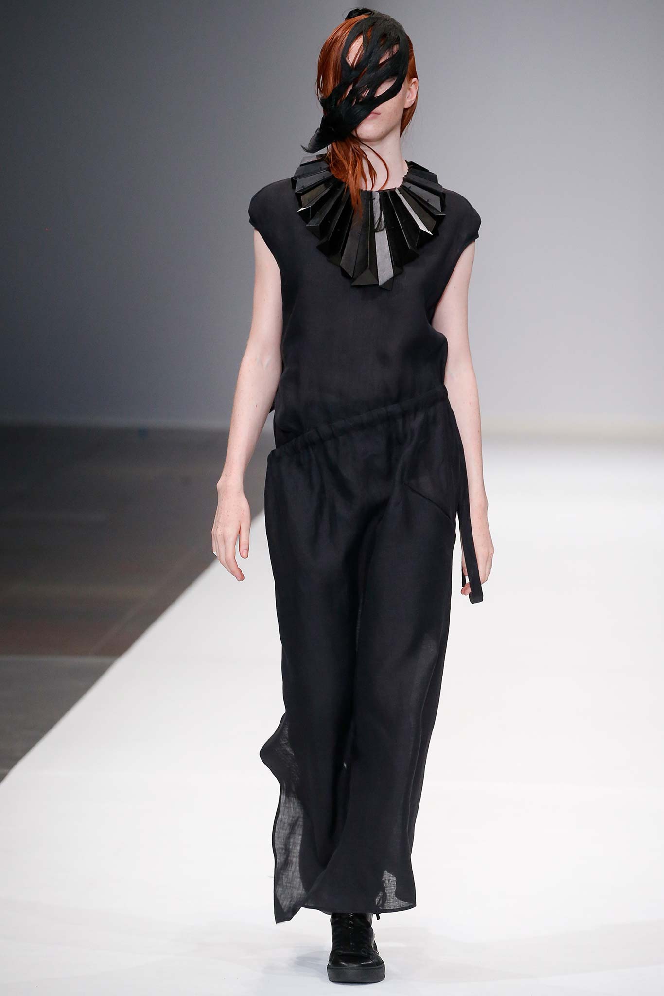 black silk sleeveless top and wide-leg pants