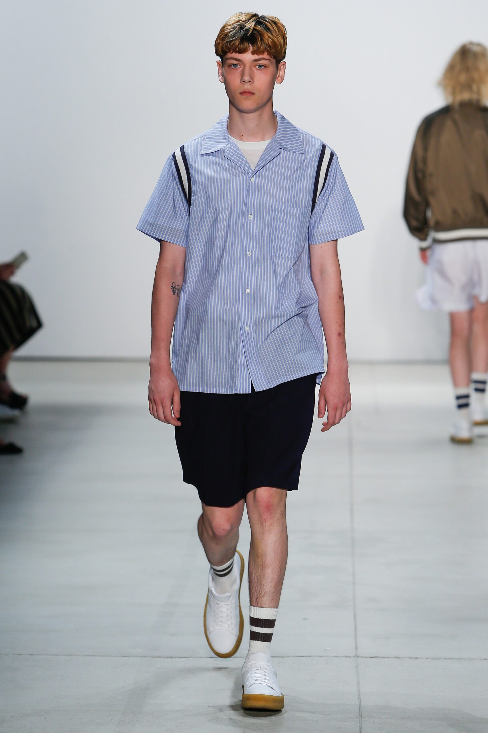 blue striped shirt black shorts