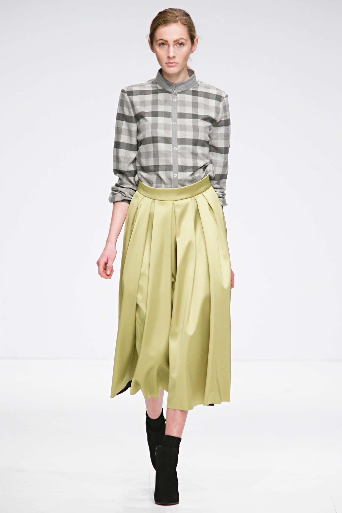 gray checked shirt and green pleated skirt