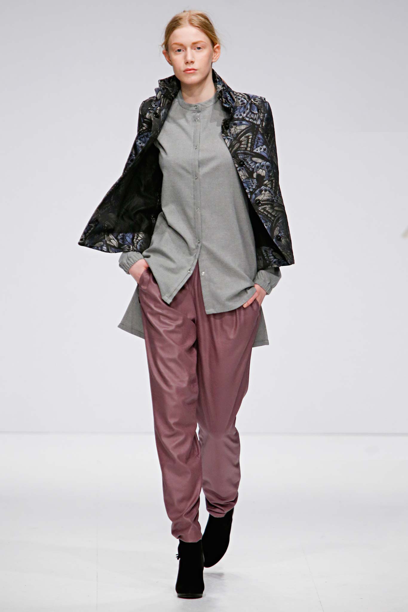 relaxed black printed jacket with gray shirt and pink pants