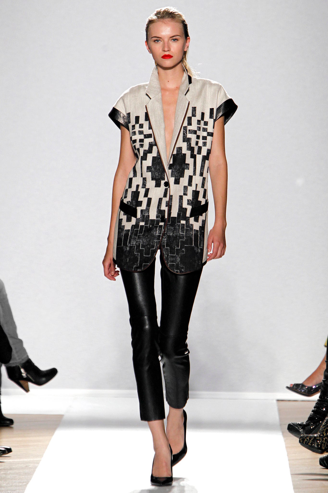 black and white printed top with leather pants