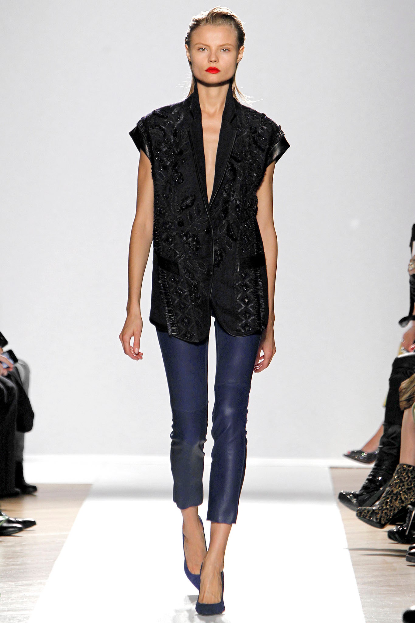 black embroidered blazer with blue pants