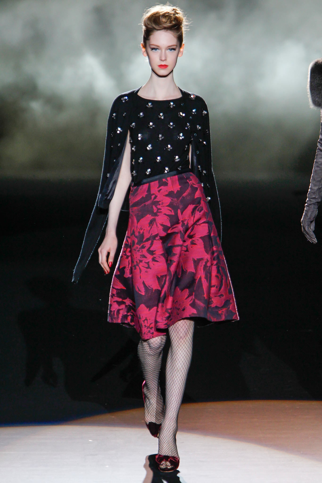 black beaded top with red skirt