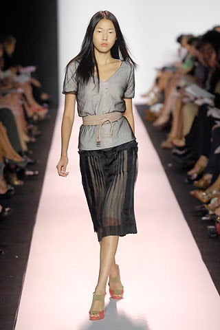 gray silk top with black skirt